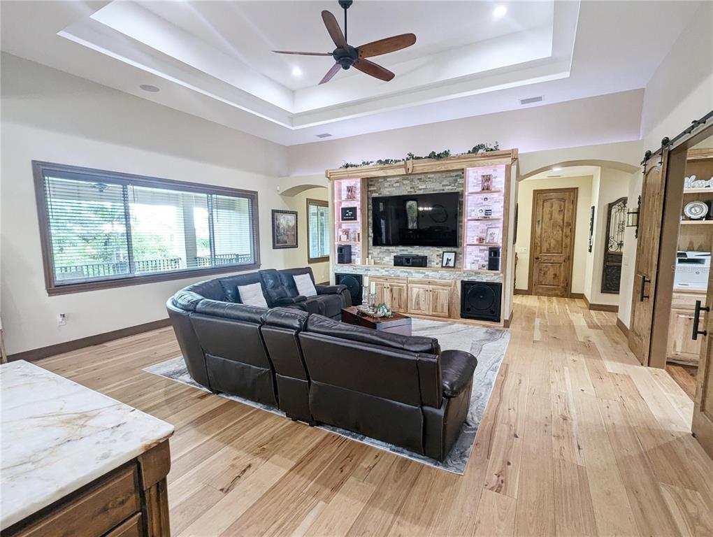 710 Albee Road West Nokomis, FL 34275 - Photo 11 of 30 a living room with furniture and a flat screen tv
