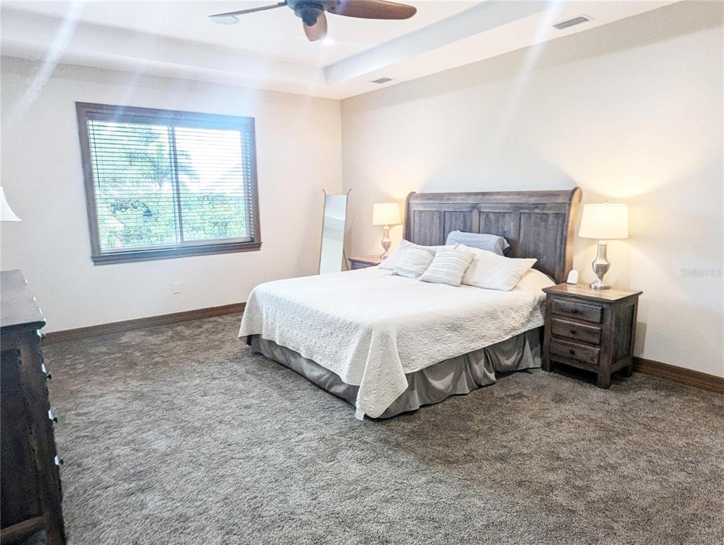 710 Albee Road West Nokomis, FL 34275 - Photo 18 of 30 a bedroom with a bed and a window