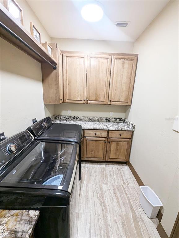 710 Albee Road West Nokomis, FL 34275 - Photo 30 of 30 a kitchen with a stove and a microwave