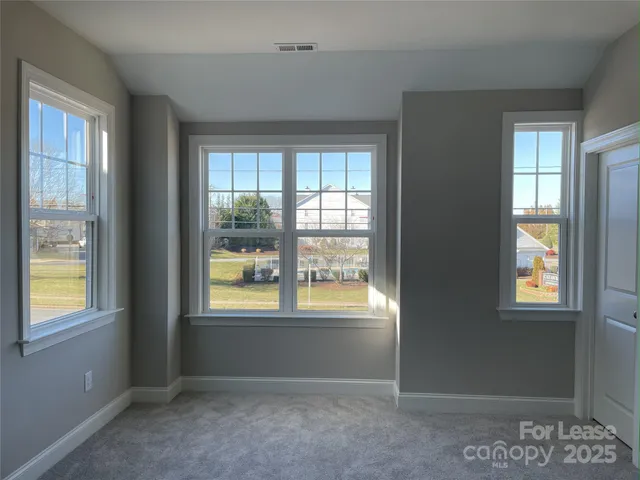 a bathroom with a granite countertop sink mirror and shower