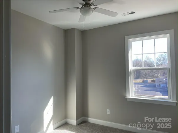 a bathroom with a bathtub and a window