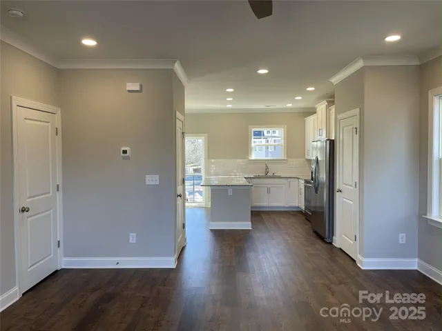 a view of kitchen with wooden floor