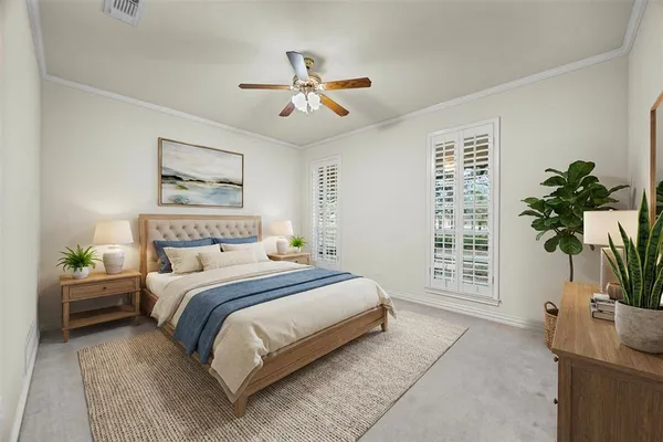 a bedroom with a large bed and a chandelier