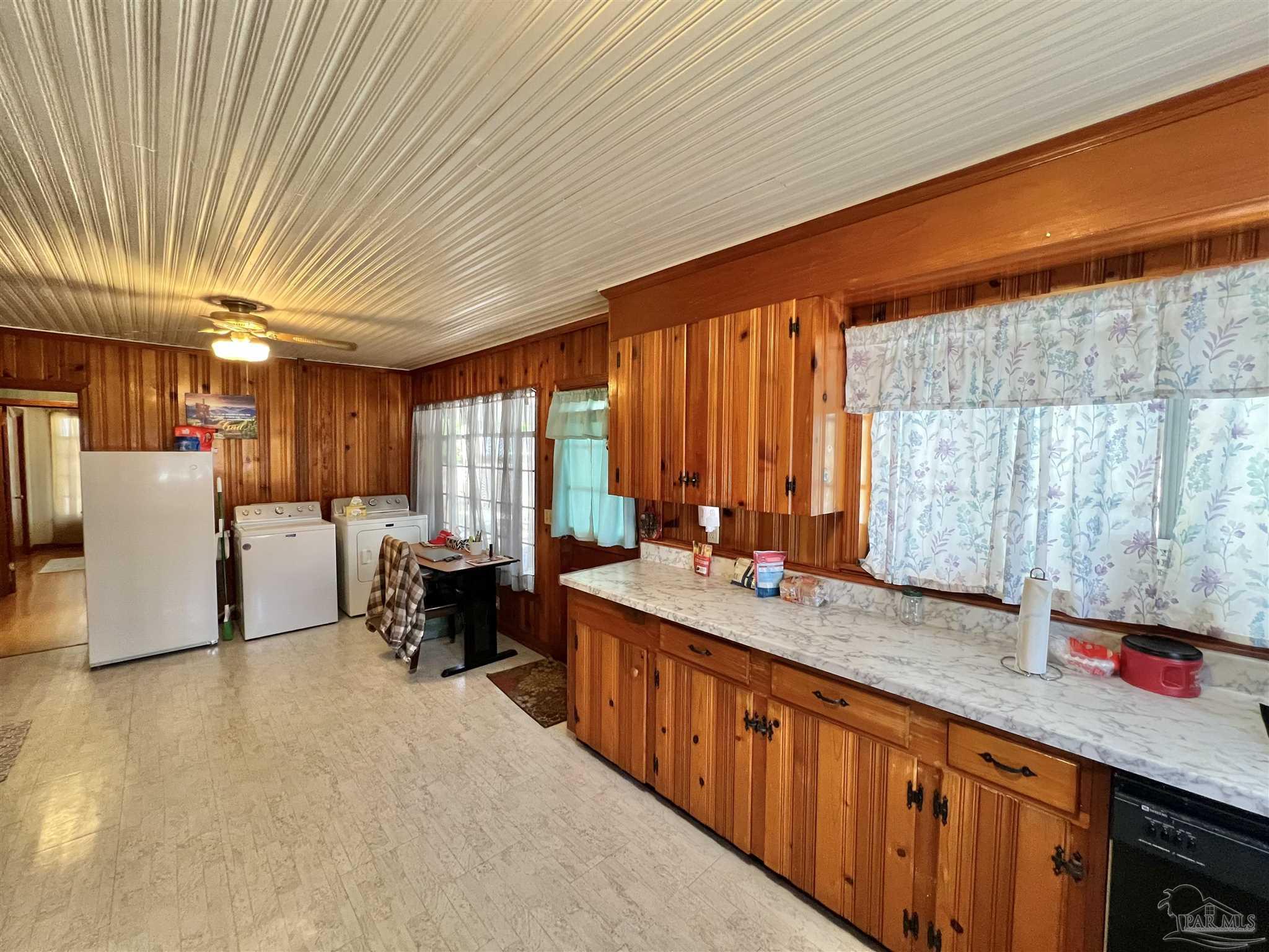 707 East Horner Street Atmore, AL 36502 - Photo 12 of 28 a large kitchen with stainless steel appliances granite countertop a sink counter space and a large window
