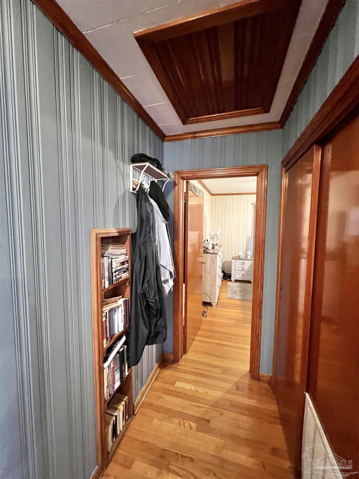 707 East Horner Street Atmore, AL 36502 - Photo 16 of 28 a view of a hallway with wooden walls and stairs