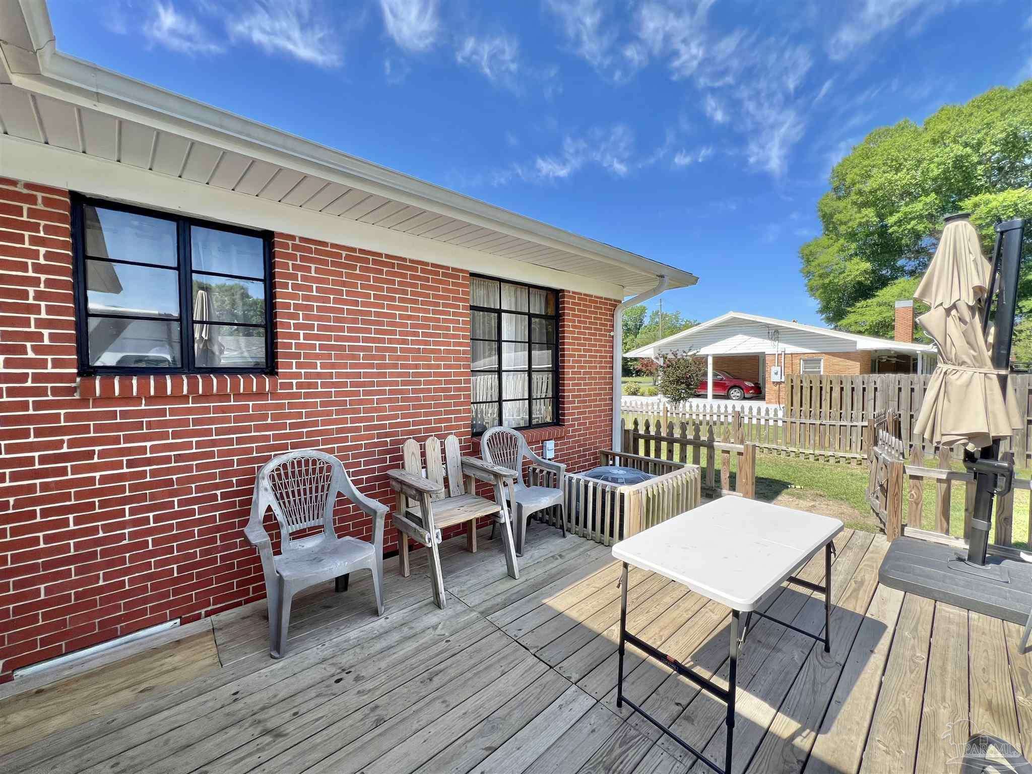 707 East Horner Street Atmore, AL 36502 - Photo 22 of 28 a balcony with table and chairs