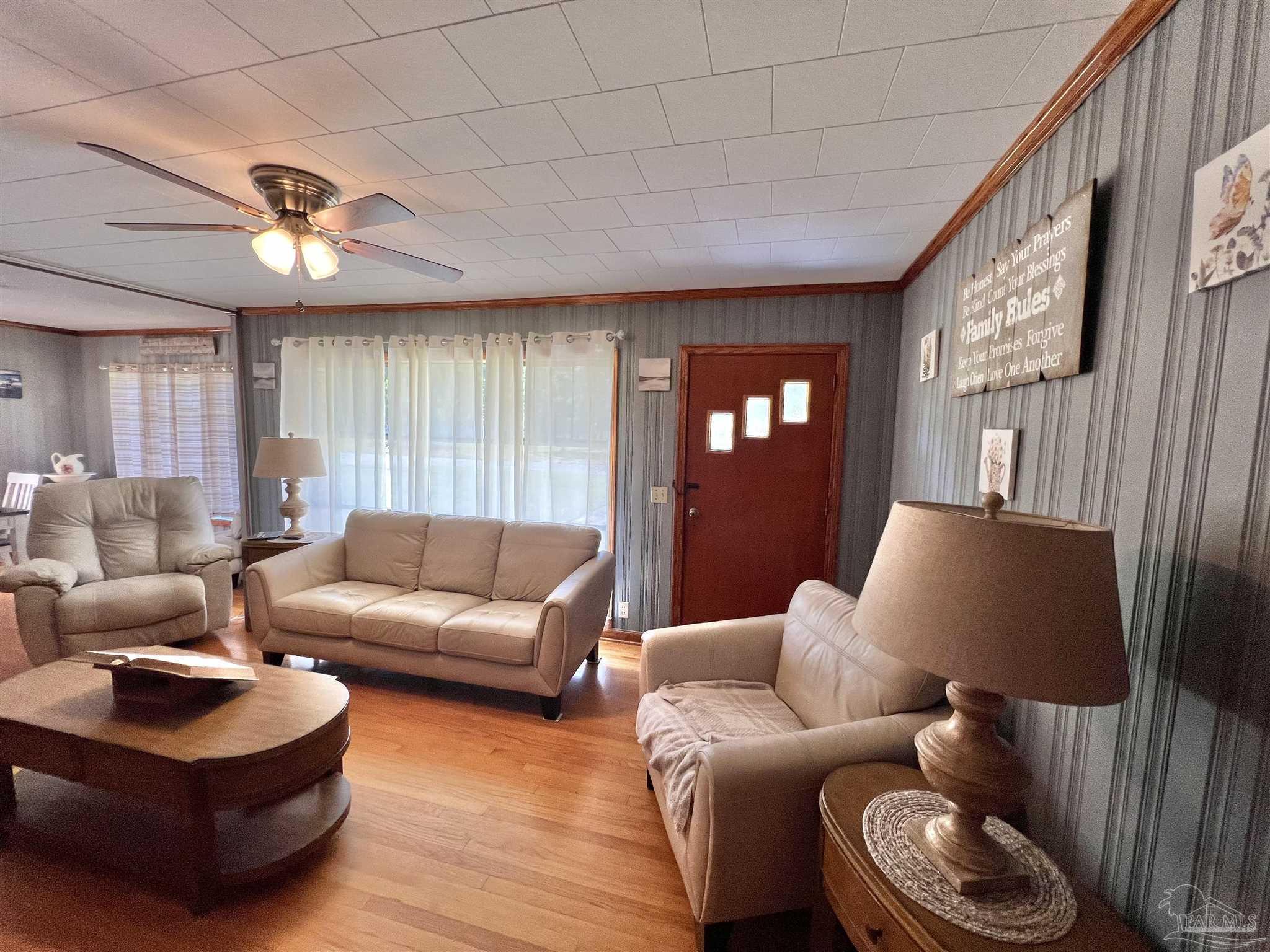 707 East Horner Street Atmore, AL 36502 - Photo 3 of 28 a living room with furniture and a large window