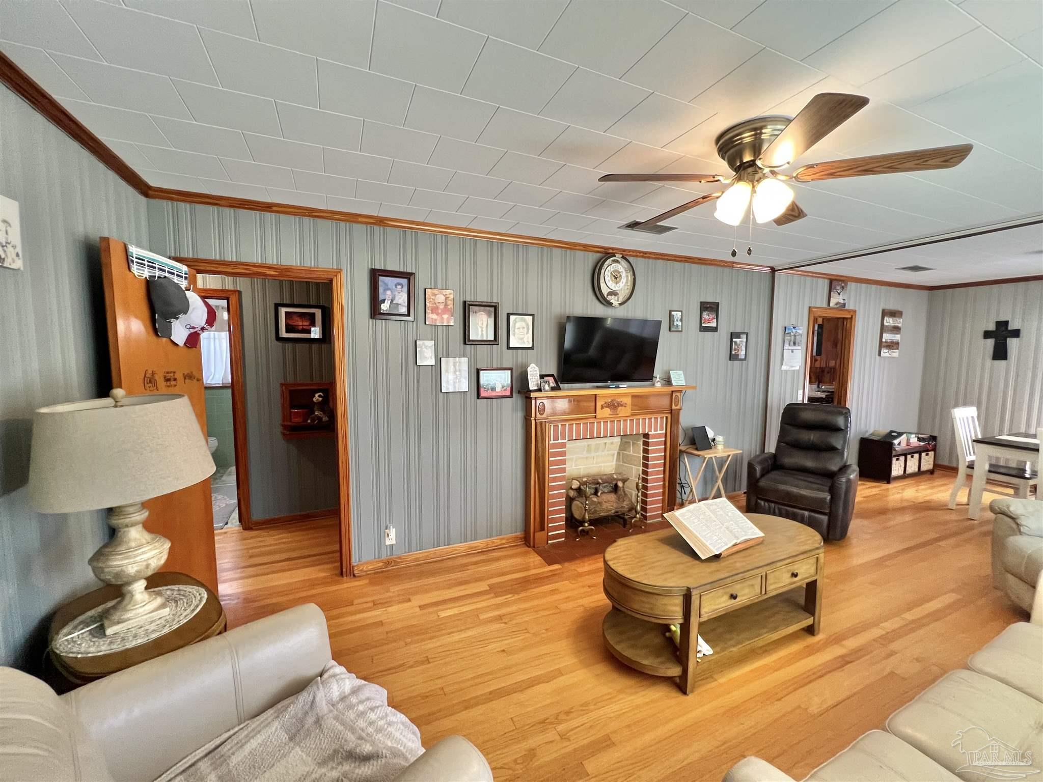 707 East Horner Street Atmore, AL 36502 - Photo 4 of 28 a living room with furniture and a flat screen tv