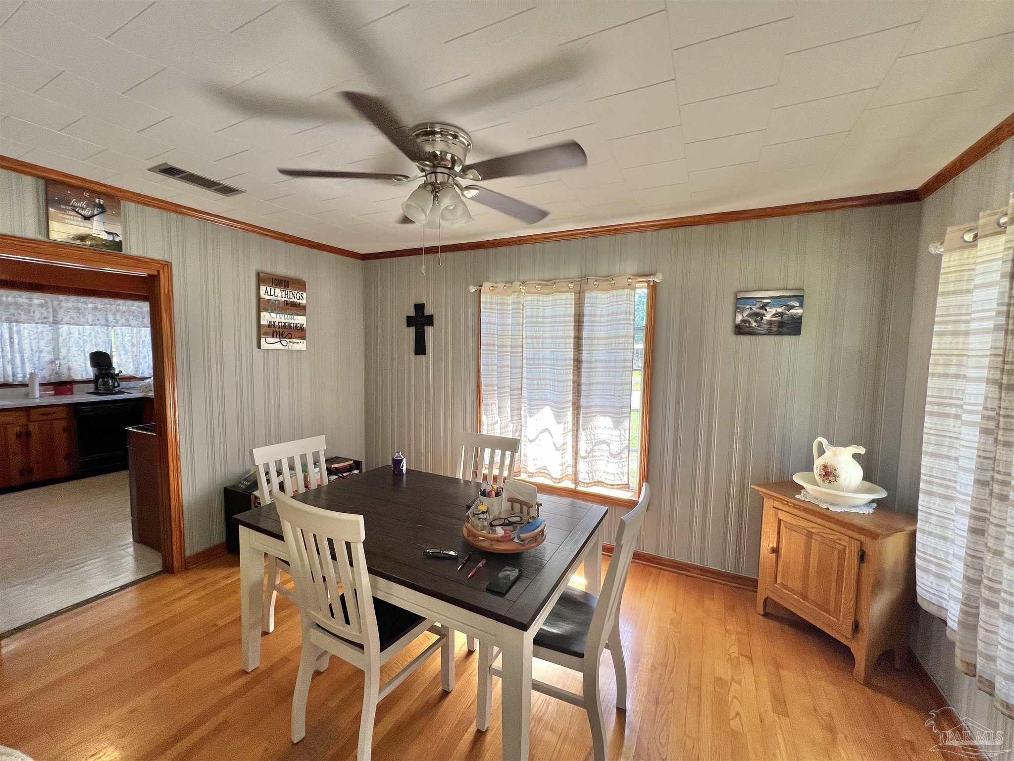 707 East Horner Street Atmore, AL 36502 - Photo 6 of 28 a living room with furniture and wooden floor