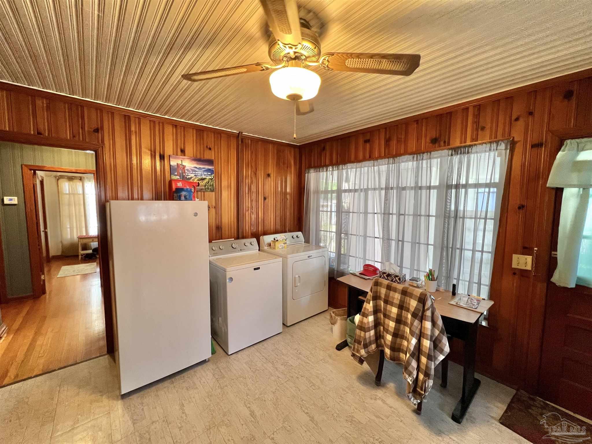 707 East Horner Street Atmore, AL 36502 - Photo 7 of 28 a storage room with washer and dryer