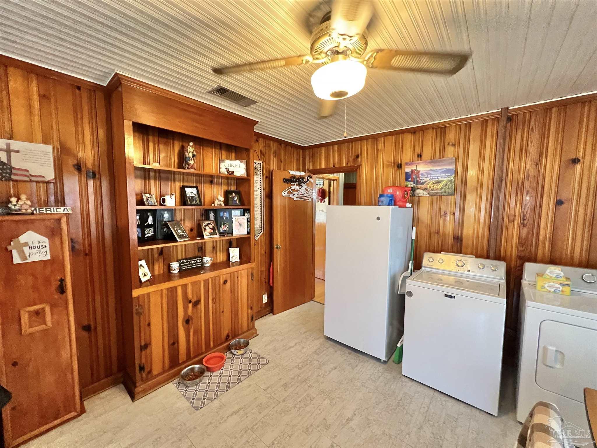 707 East Horner Street Atmore, AL 36502 - Photo 8 of 28 a storage room with washer and dryer