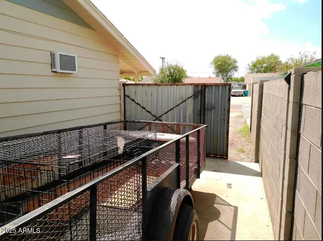 a view of balcony with wooden floor and fence