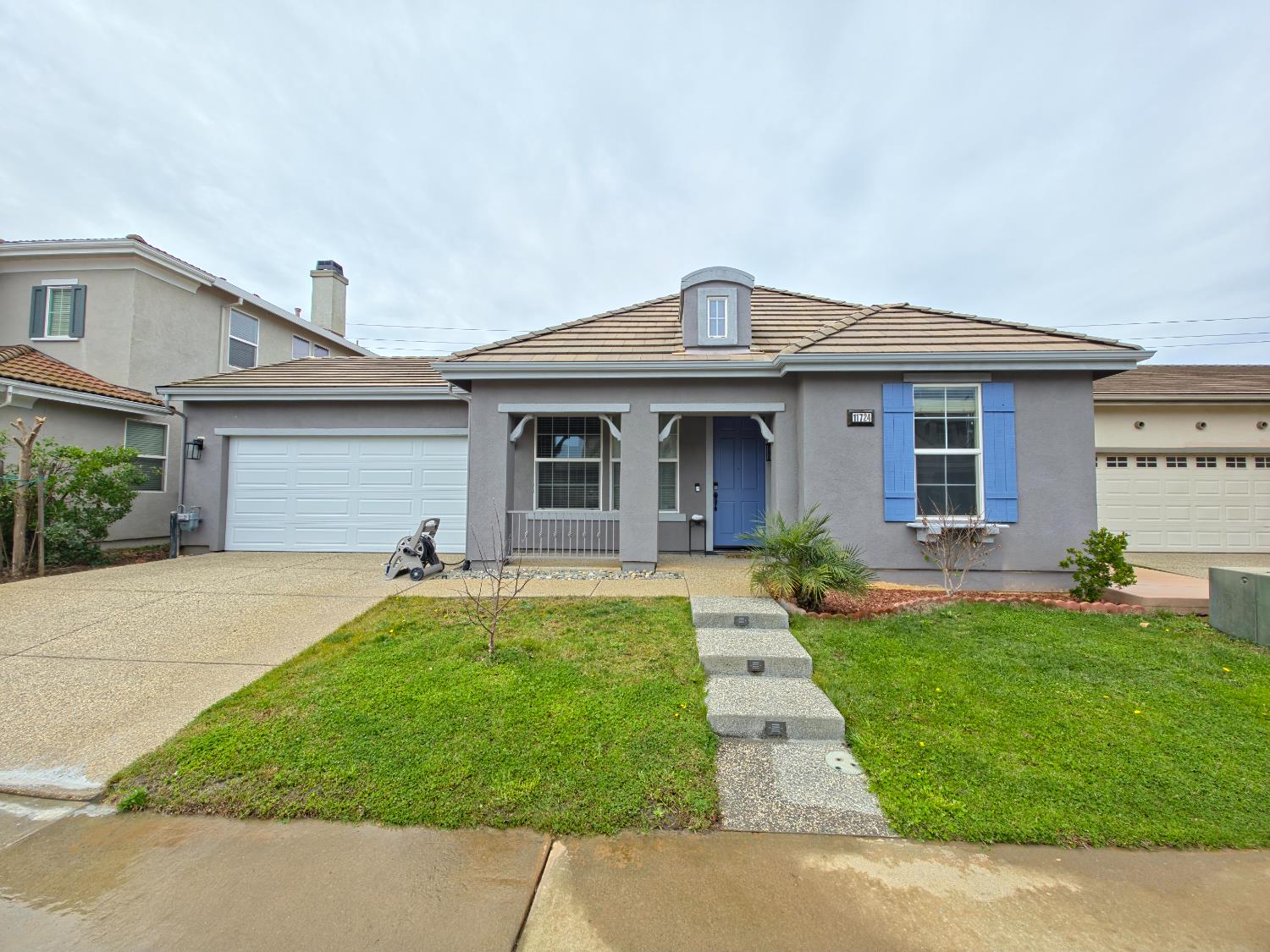 11724 Brook Valley Way Rancho Cordova, CA 95742 - Photo 1 of 32 a front view of a house with a yard