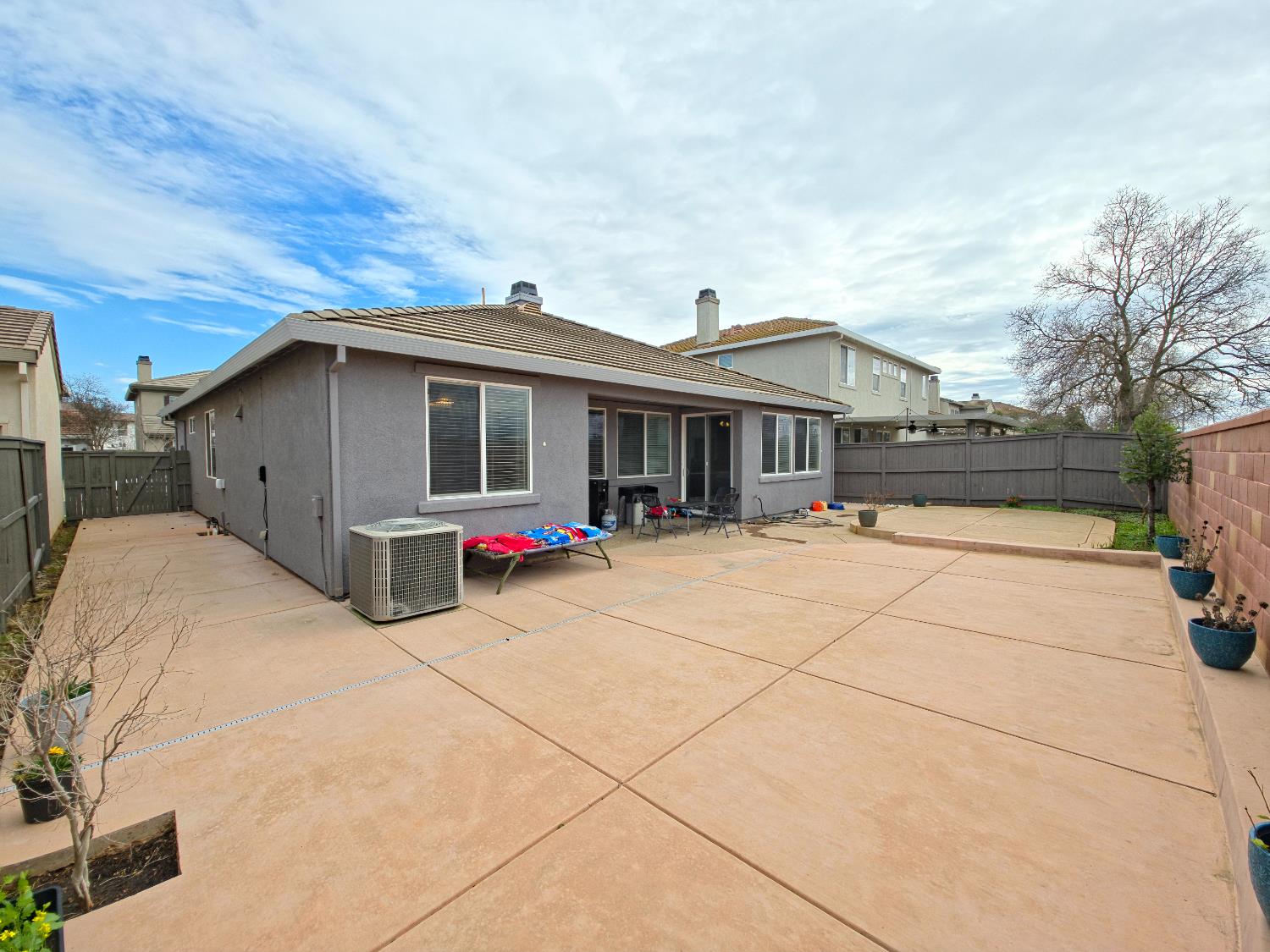 11724 Brook Valley Way Rancho Cordova, CA 95742 - Photo 11 of 32 a view of a house with a yard and potted plants