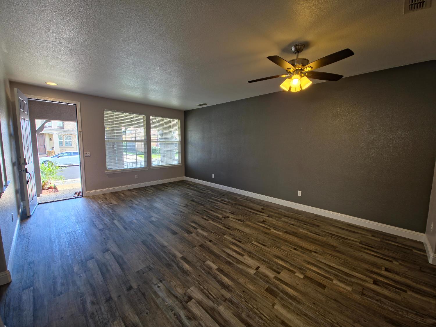 11724 Brook Valley Way Rancho Cordova, CA 95742 - Photo 14 of 32 wooden floor in an empty room with a window