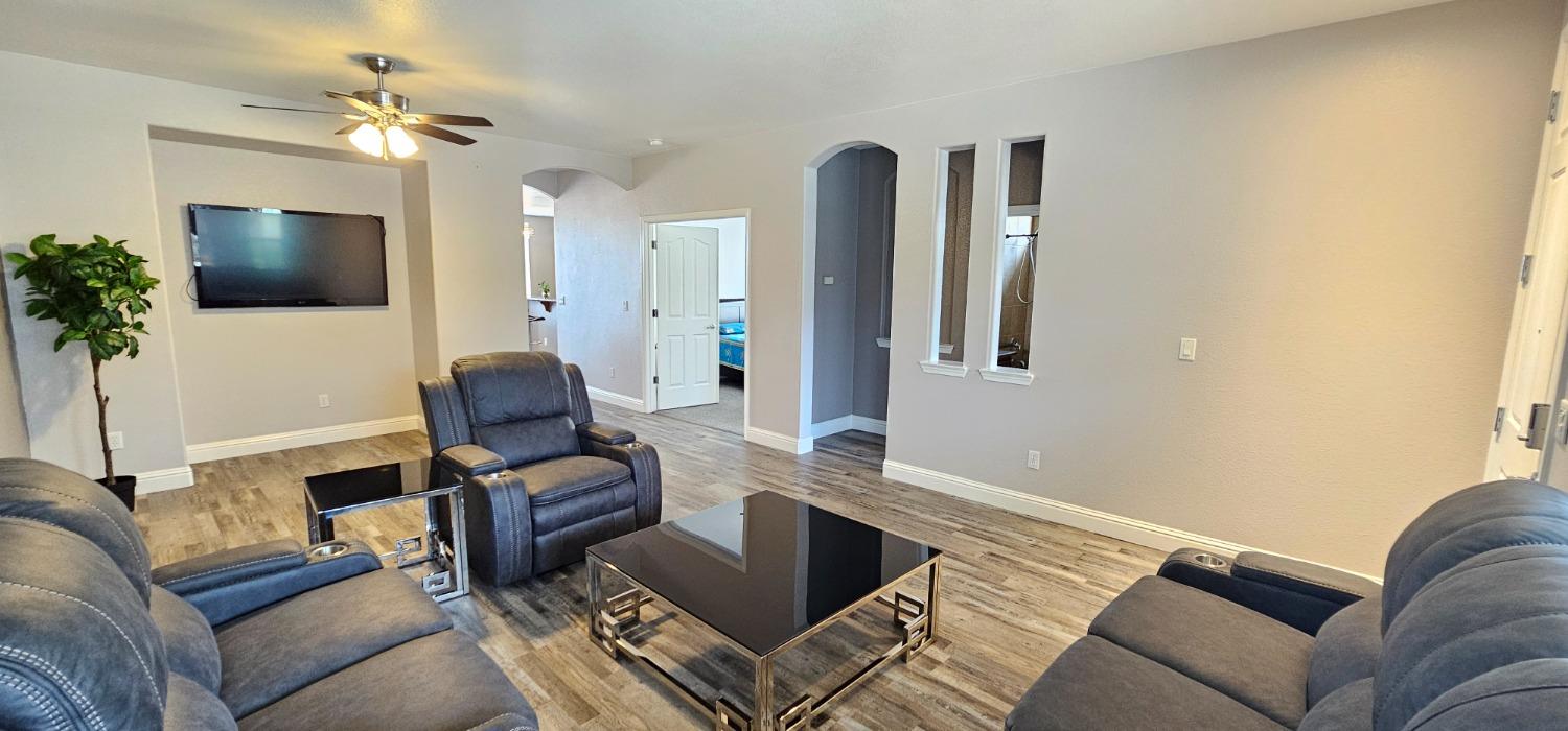 11724 Brook Valley Way Rancho Cordova, CA 95742 - Photo 19 of 32 a living room with furniture and a flat screen tv