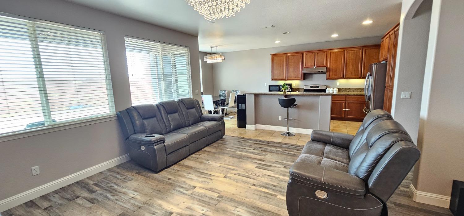 11724 Brook Valley Way Rancho Cordova, CA 95742 - Photo 26 of 32 a living room with furniture and a large window