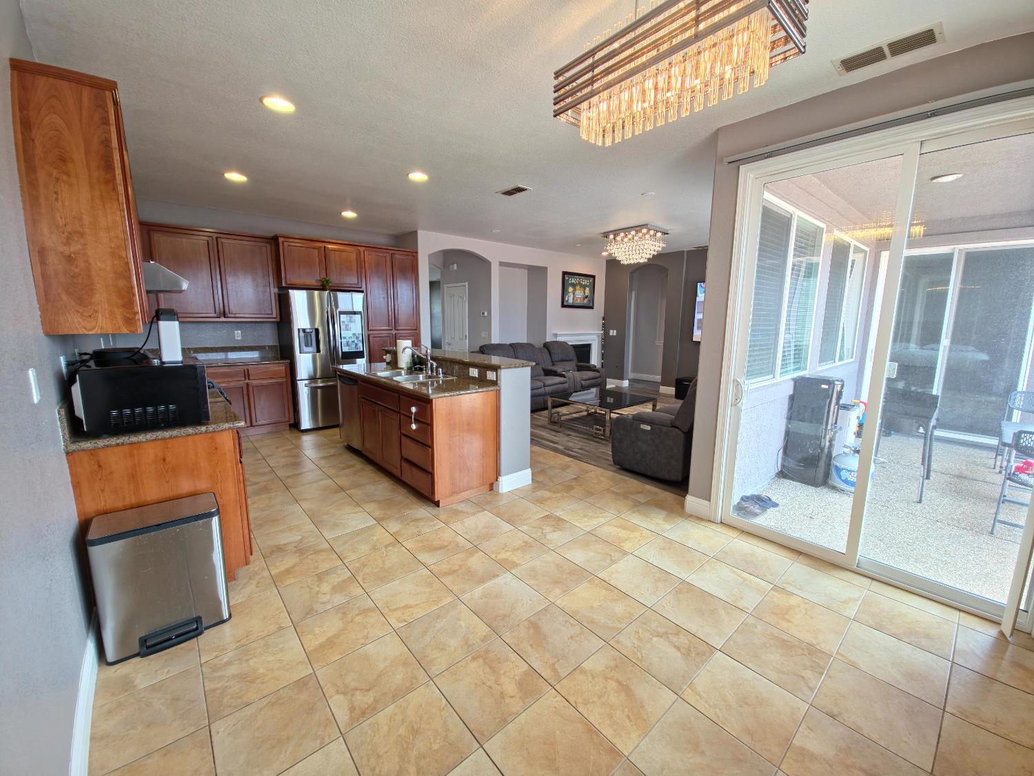 11724 Brook Valley Way Rancho Cordova, CA 95742 - Photo 4 of 32 a kitchen with stainless steel appliances granite countertop a refrigerator and a stove top oven