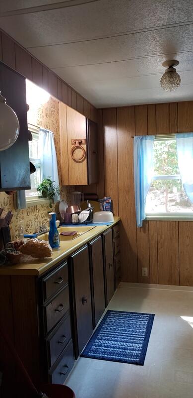 800 Covered Bridge Road Rogue River, OR 97537 - Photo 4 of 25 a kitchen with a sink and large window