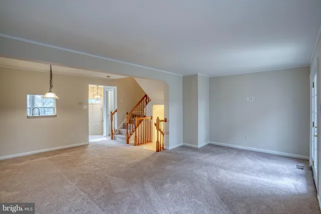 a view of empty room with ceiling fan