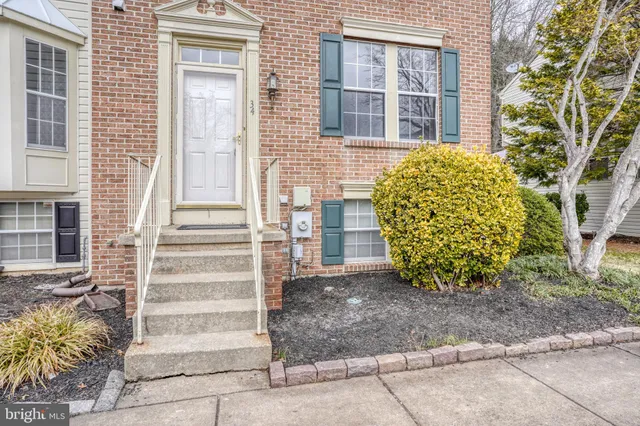 a view of a house with a window and brick walls