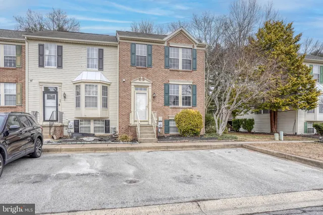an aerial view of a house with outdoor space