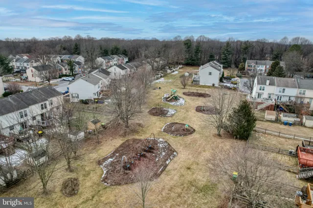 a aerial view of a house with a yard