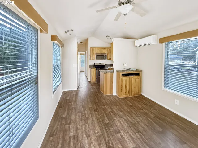 a view of a kitchen with a sink wooden floor and a kitchen