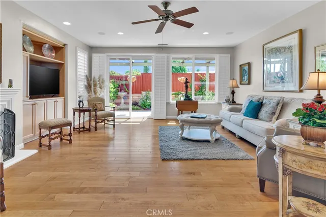 a living room with furniture fireplace and a flat screen tv