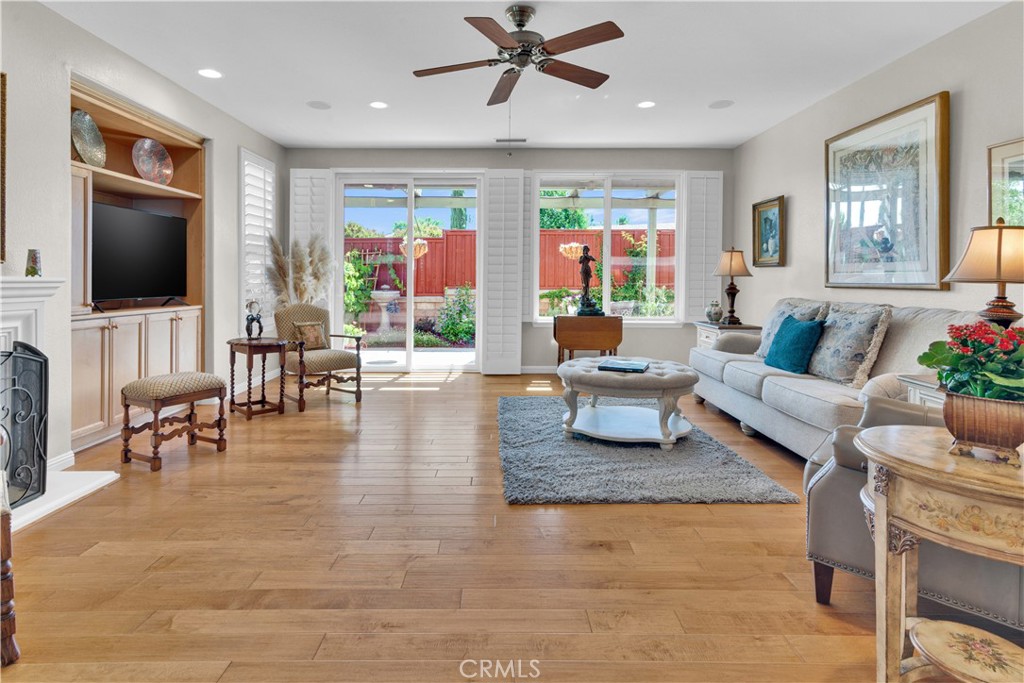 2757 Traditions Loop Paso Robles, CA 93446 - Photo 11 of 58 a living room with fireplace furniture and a flat screen tv