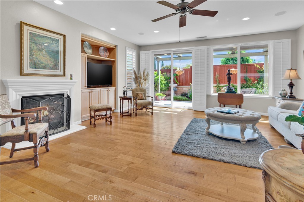 2757 Traditions Loop Paso Robles, CA 93446 - Photo 12 of 58 a living room with furniture fireplace and a flat screen tv