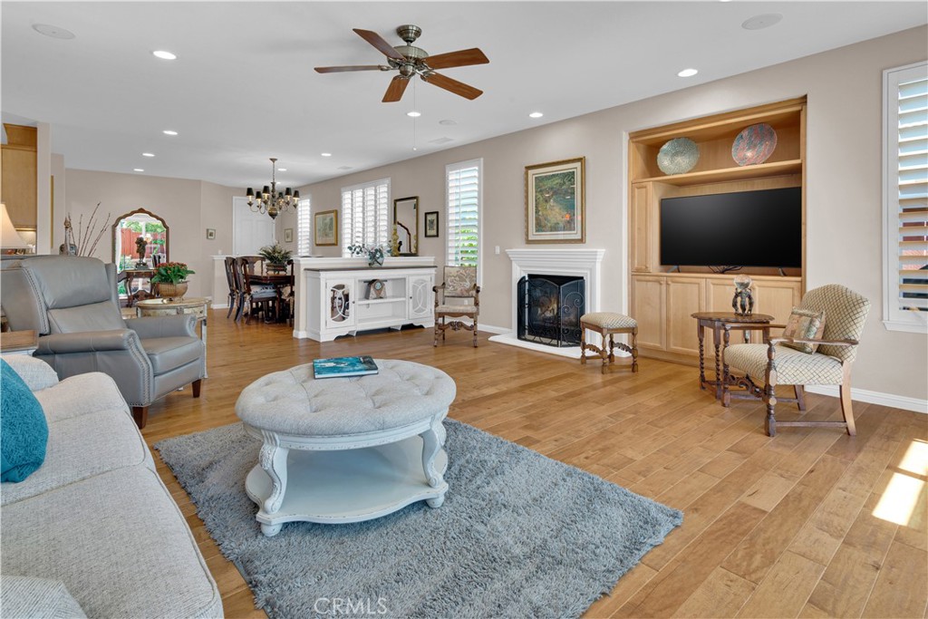 2757 Traditions Loop Paso Robles, CA 93446 - Photo 13 of 58 a living room with furniture a fireplace and a flat screen tv