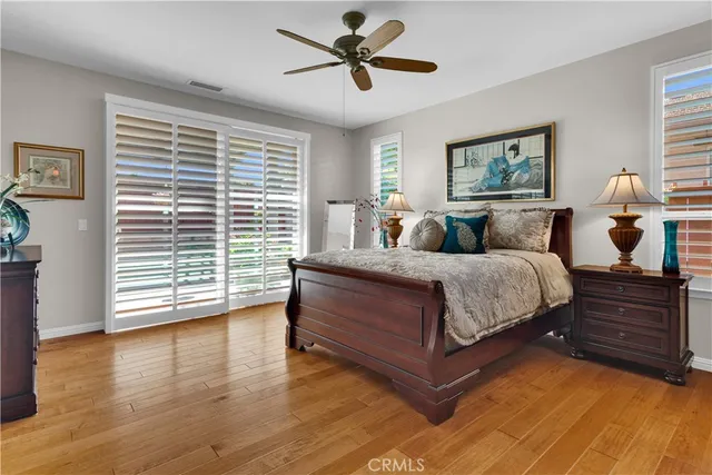a living room with a bed furniture and a flat tv screen