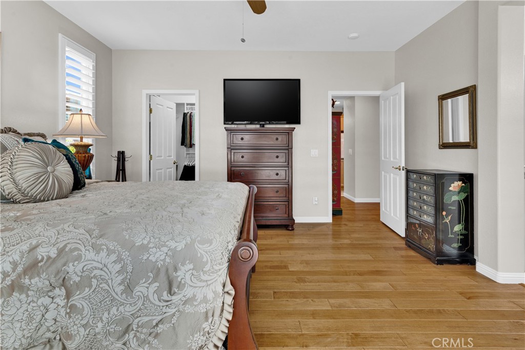 2757 Traditions Loop Paso Robles, CA 93446 - Photo 29 of 58 a bedroom with a bed and a flat screen tv