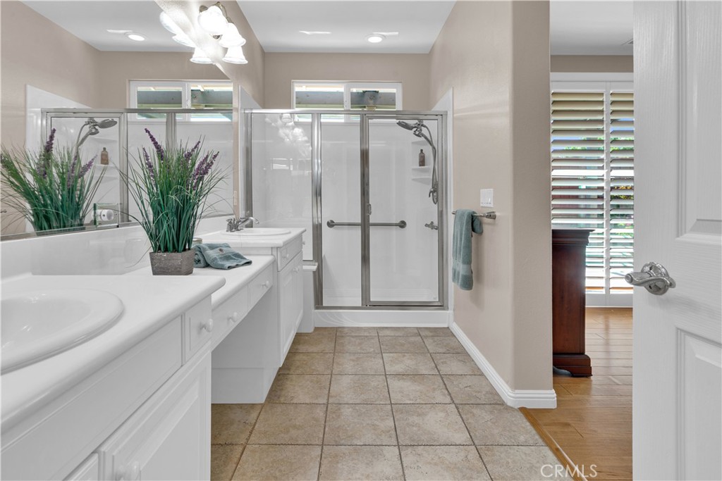 2757 Traditions Loop Paso Robles, CA 93446 - Photo 33 of 58 a bathroom with a shower a sink and a mirror