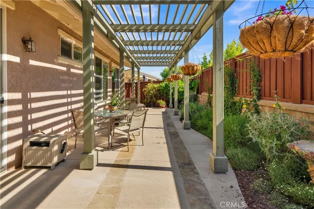 a front view of a house with a yard and fountain