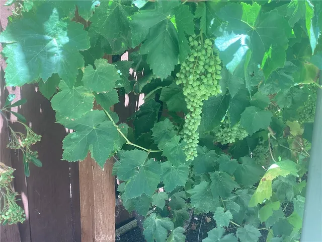 a swimming pool with outdoor seating and yard