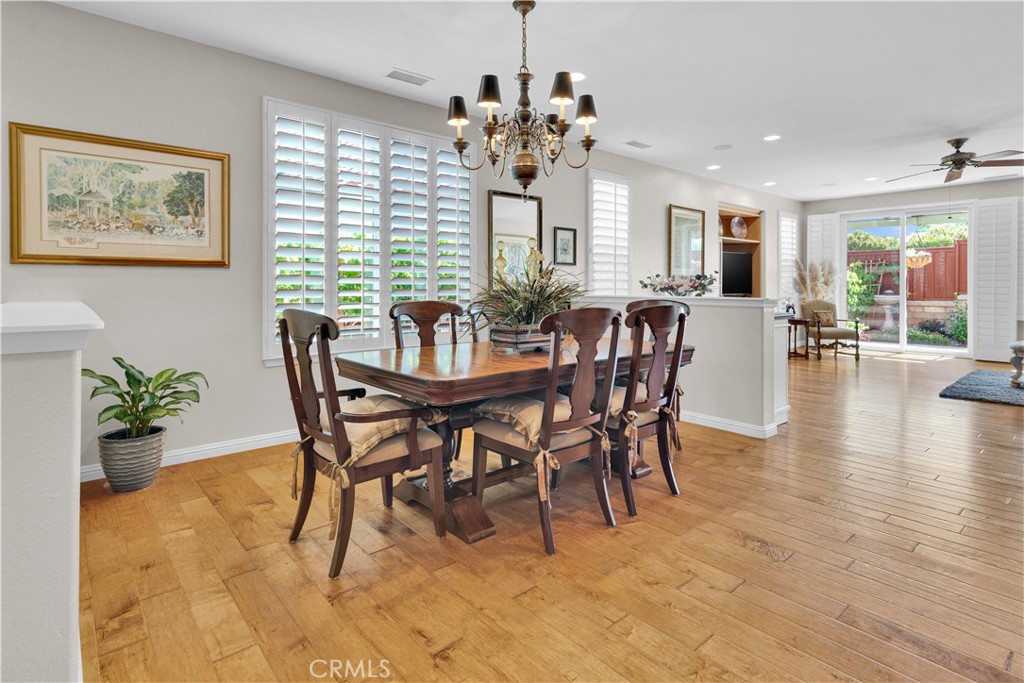 2757 Traditions Loop Paso Robles, CA 93446 - Photo 9 of 58 a view of a dining room with furniture window and wooden floor