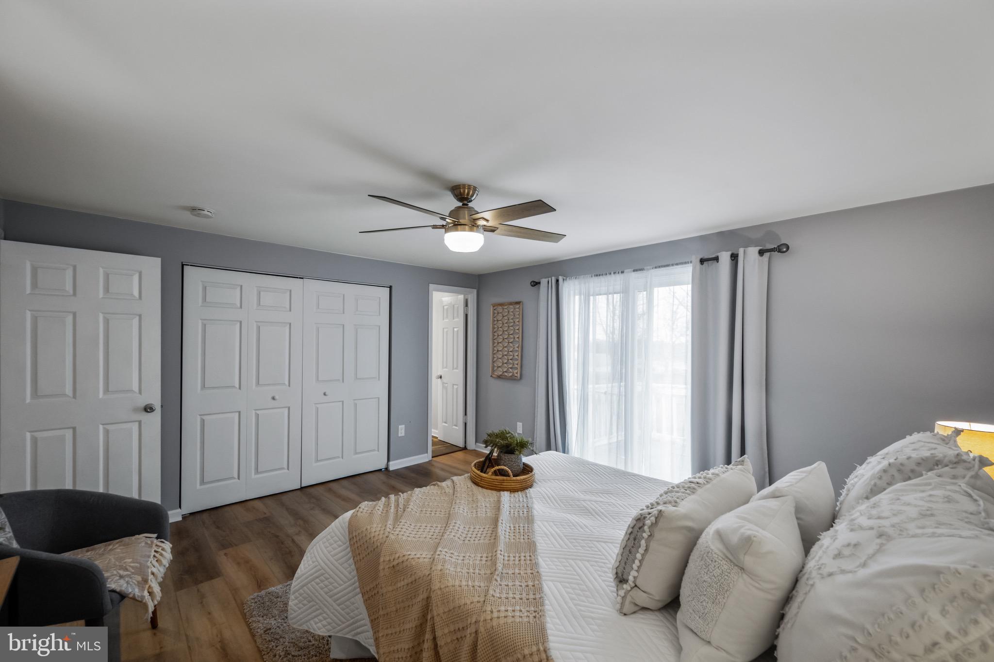 15915 Trenton Road Upperco, MD 21155 - Photo 18 of 41 a bedroom with a bed and a chandelier