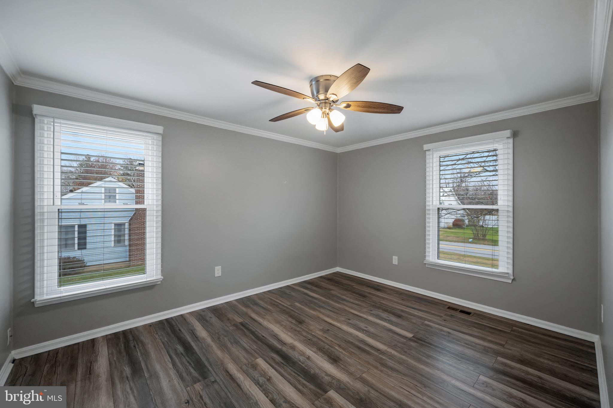 15915 Trenton Road Upperco, MD 21155 - Photo 22 of 41 a view of an empty room with a window and wooden floor