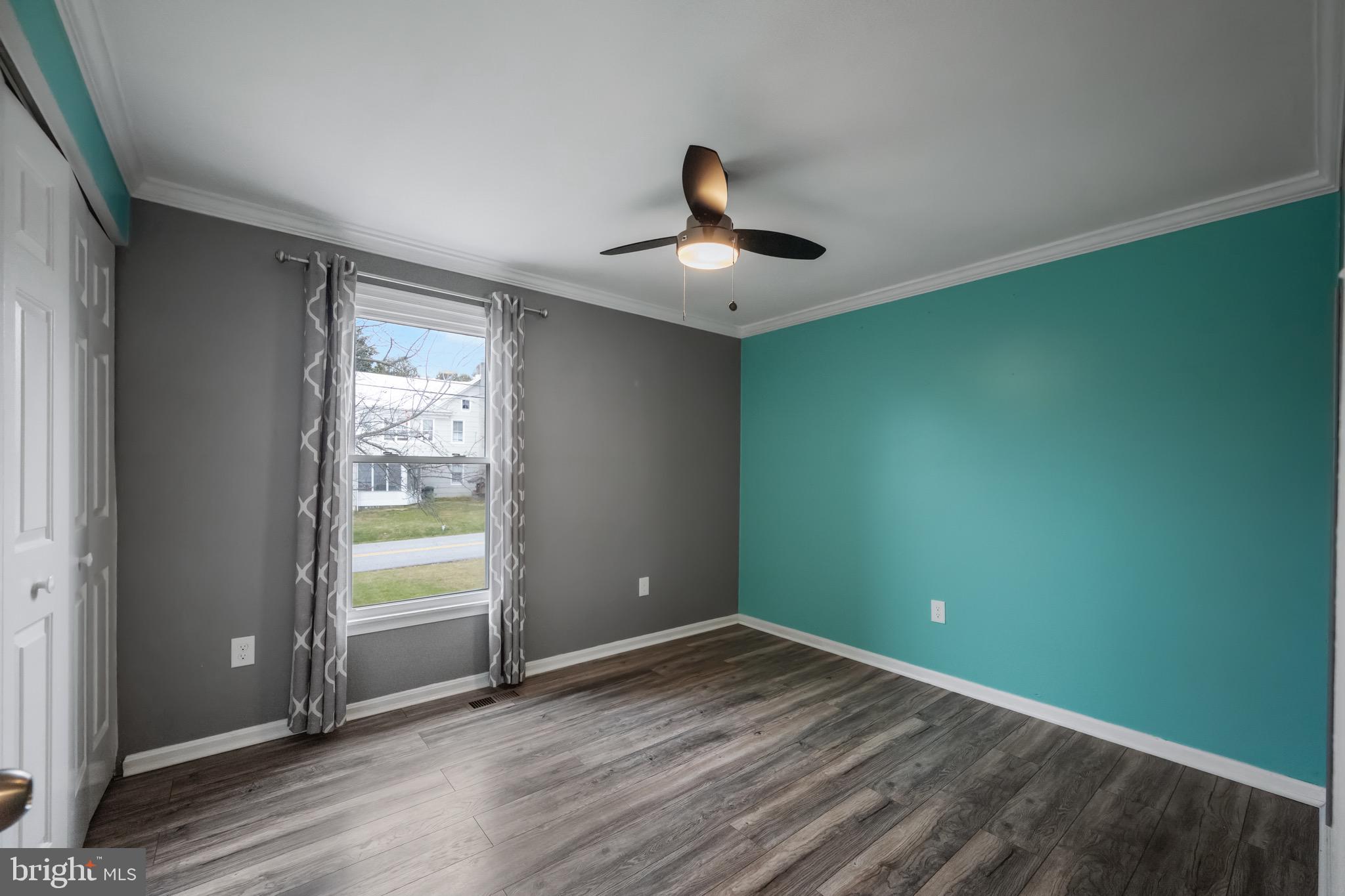 15915 Trenton Road Upperco, MD 21155 - Photo 25 of 41 an empty room with wooden floor and windows