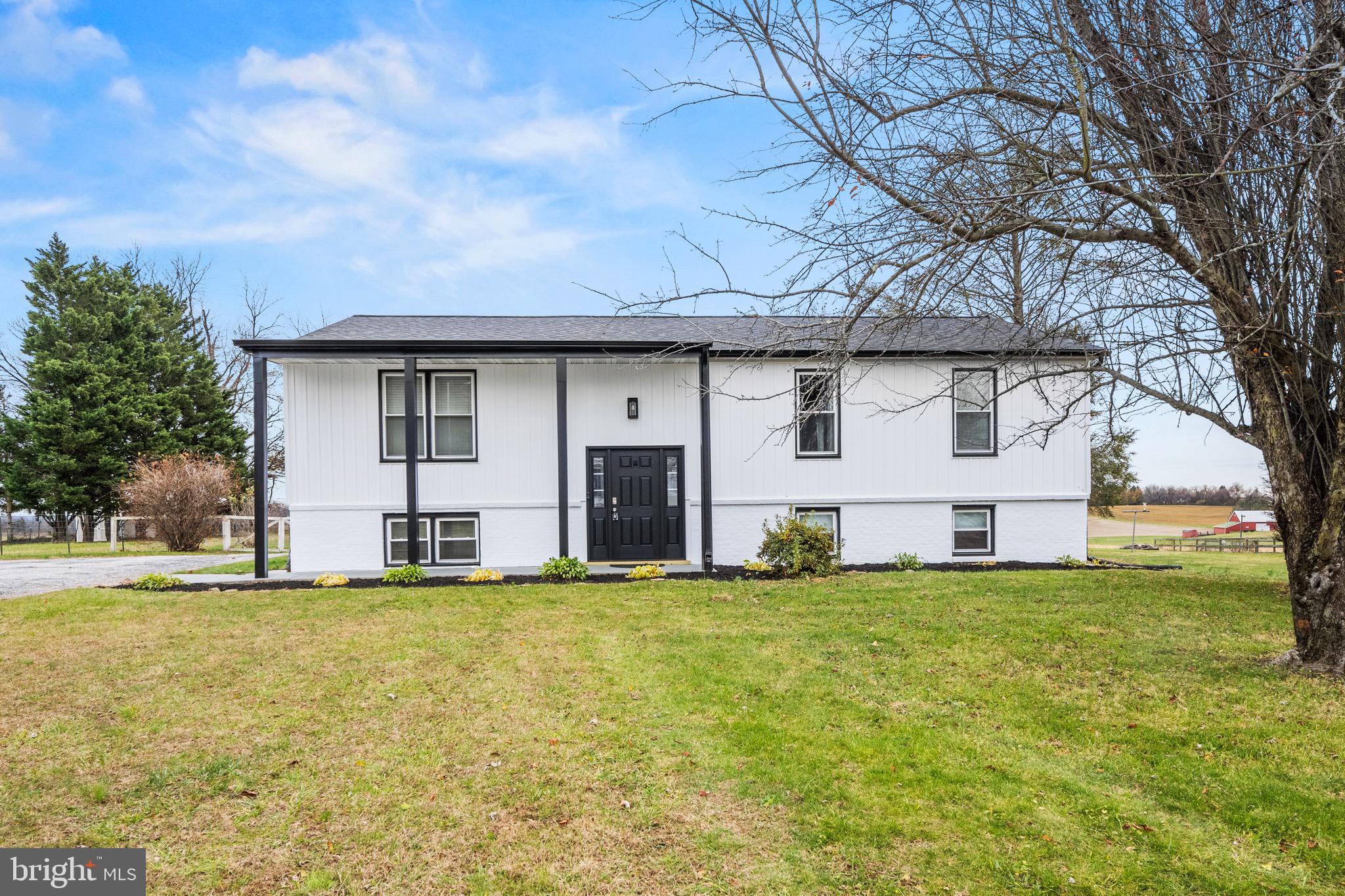 15915 Trenton Road Upperco, MD 21155 - Photo 34 of 41 a view of a house with a big yard and large trees