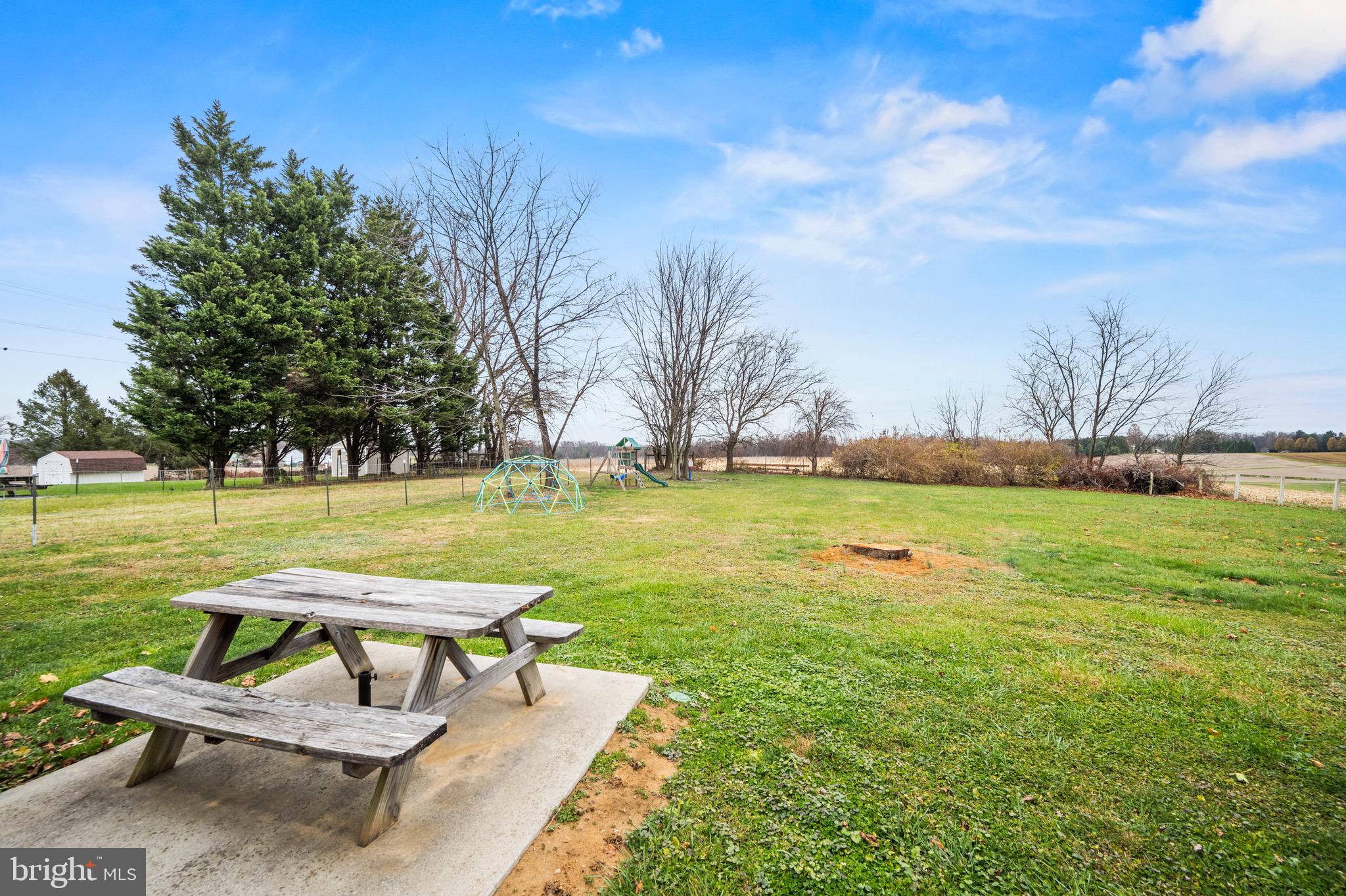 15915 Trenton Road Upperco, MD 21155 - Photo 35 of 41 a swimming pool with lawn chairs and a fire pit