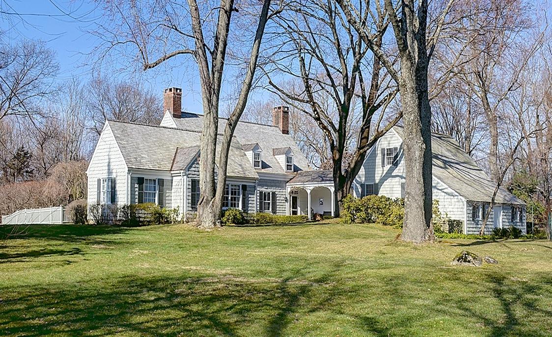 1062 Ponus Ridge Road New Canaan, CT 06840 - Photo 1 of 31 a front view of building with yard