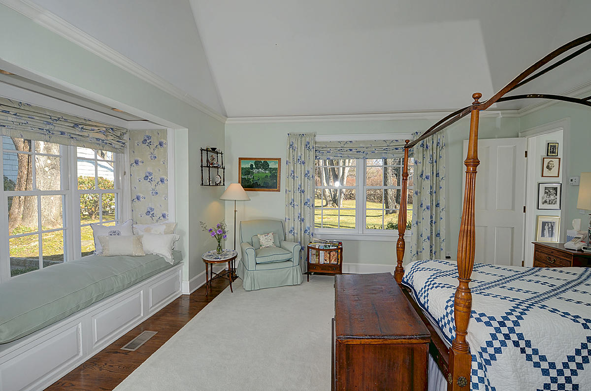 1062 Ponus Ridge Road New Canaan, CT 06840 - Photo 14 of 31 a spacious bedroom with a large bed and a large window