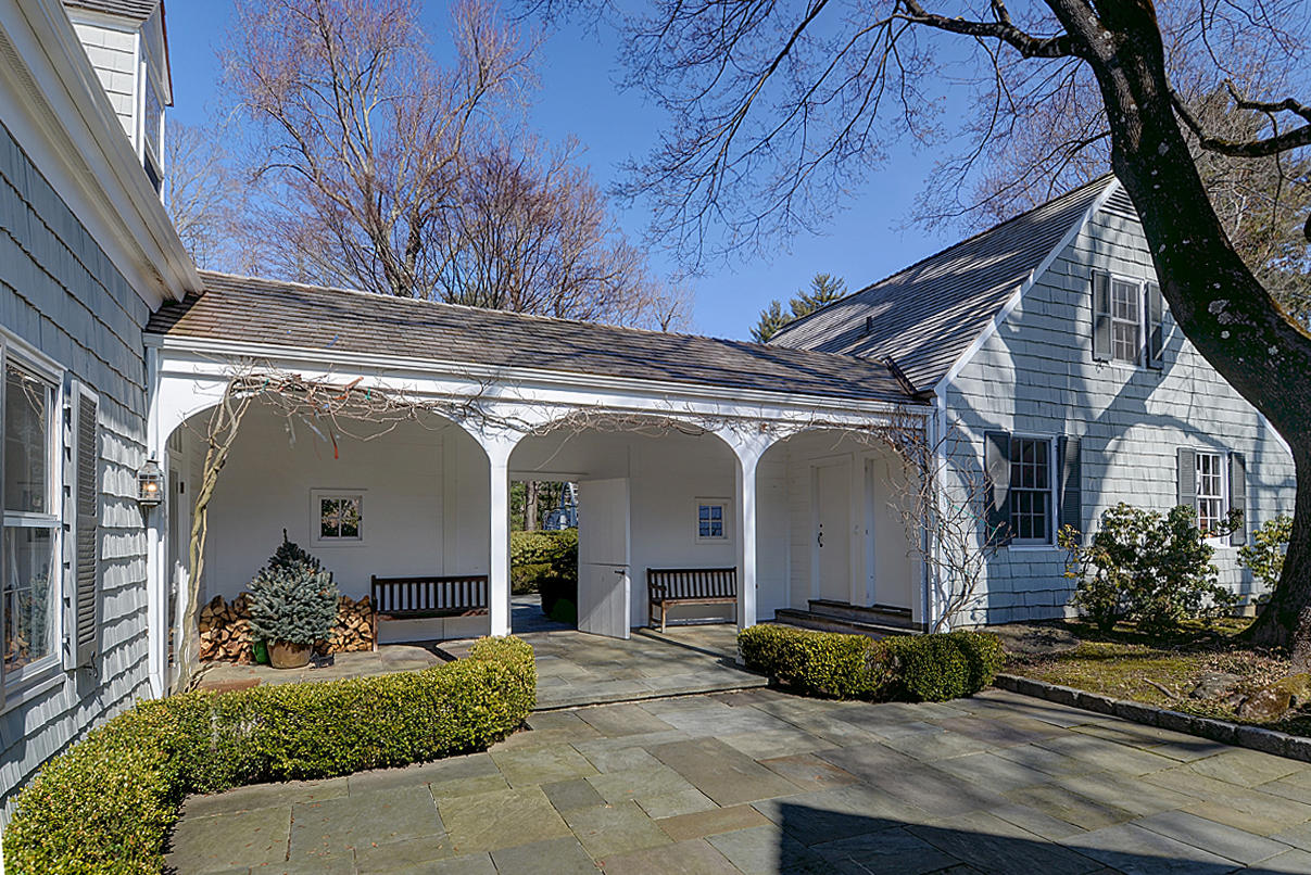 1062 Ponus Ridge Road New Canaan, CT 06840 - Photo 2 of 31 a view of a house with a garage