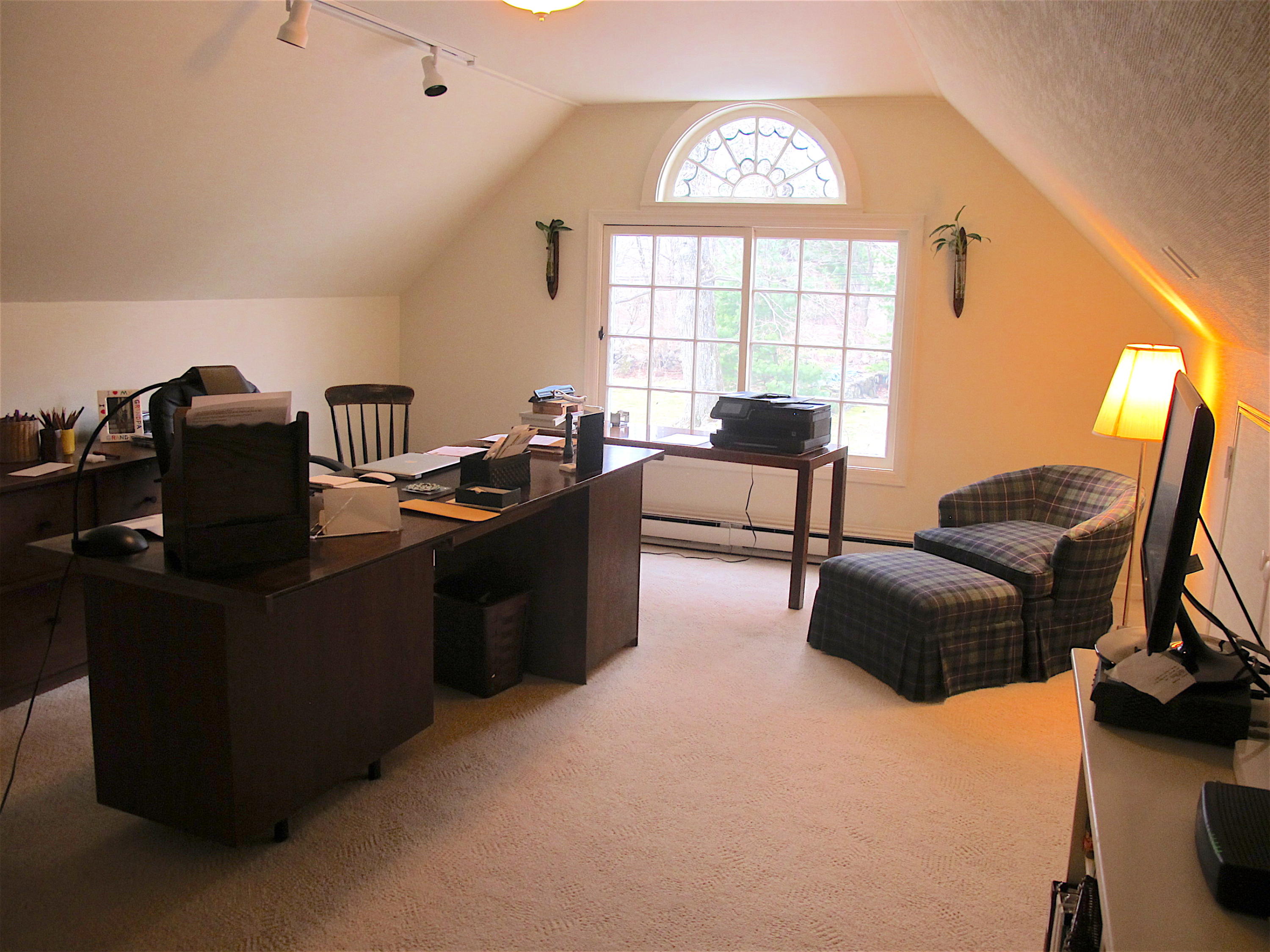 1062 Ponus Ridge Road New Canaan, CT 06840 - Photo 23 of 31 a living room with furniture and a window