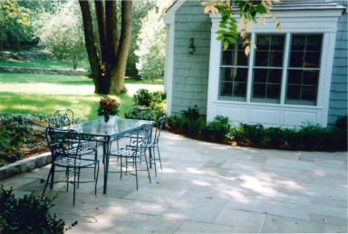 1062 Ponus Ridge Road New Canaan, CT 06840 - Photo 30 of 31 a view of a house with backyard sitting area and garden