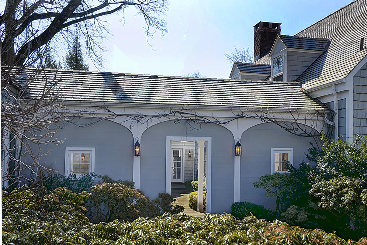 1062 Ponus Ridge Road New Canaan, CT 06840 - Photo 6 of 31 front view of a house with a small yard
