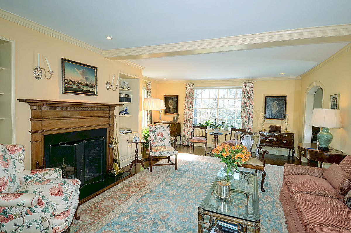 1062 Ponus Ridge Road New Canaan, CT 06840 - Photo 8 of 31 a living room with furniture large window and a fireplace